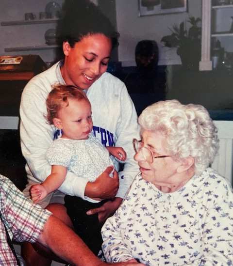 The poet, Theresa Squires Collins, holding out her infant daughter, Maeve, to her grandmother and Maeve's great-grandmother, Theresa Goettemoeller Gagel.